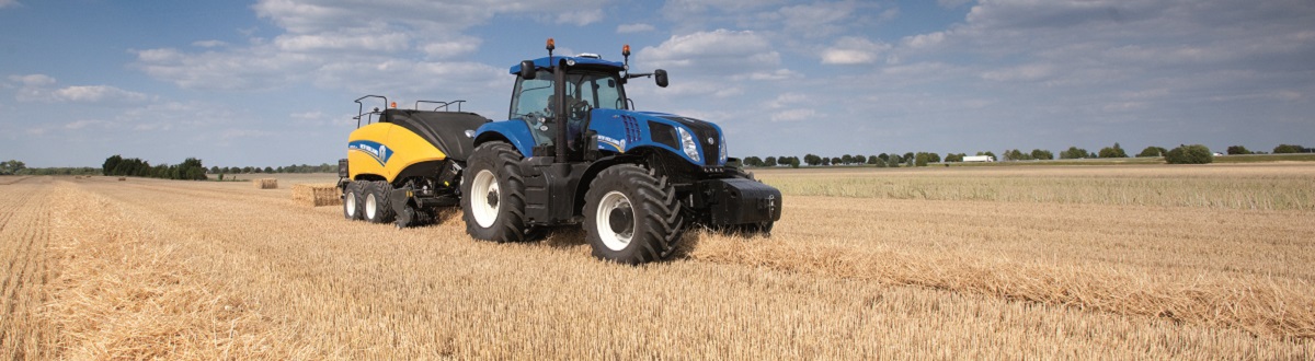 New Holland Tractor resting in agricultural field